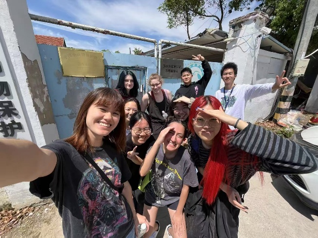 A group of people posing for a photo

Description automatically generated